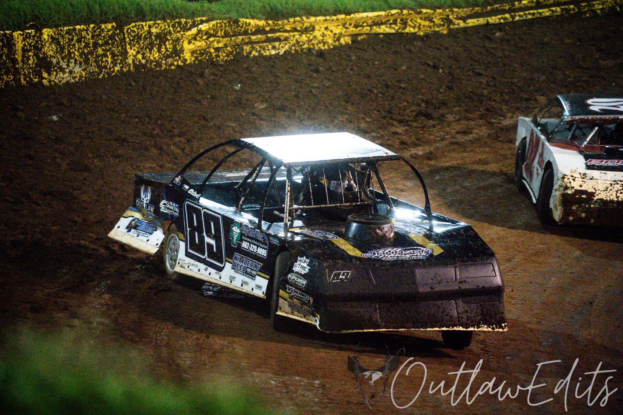 Factory stock cars racing under the lights