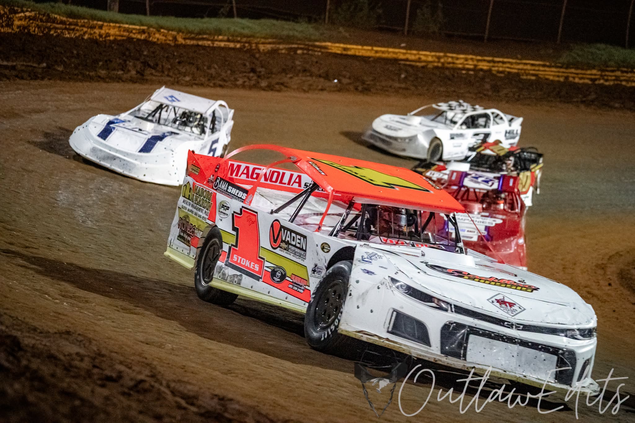 Street stock cars racing on a dirt track